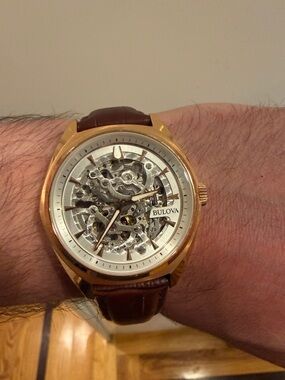Bulova Sutton gold-tone automatic brown leather strap skeleton watch, VERY GOOD